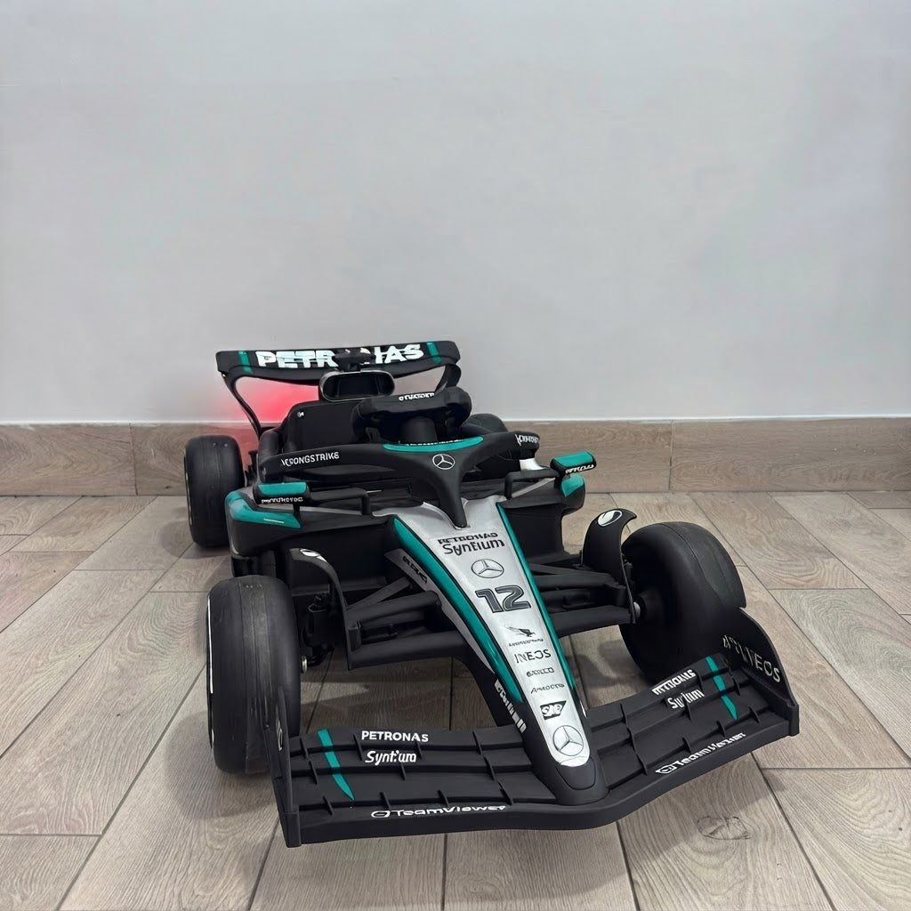 Auto Elettrica per Bambini Mercedes AMG F1 12V con Licenza Ufficiale Luci Led Suoni Realistici Display MP4 Telecomando Cinture di Sicurezza